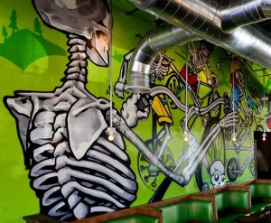 A large mural sits behind the bar area at CyclHOPS, a new bike shop/taqueria in Longmont. (cyclhops.com photo)