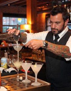 A mixologist pours on of the famed drinks at The Squeaky Bean. (Photo by Adam Larkey)