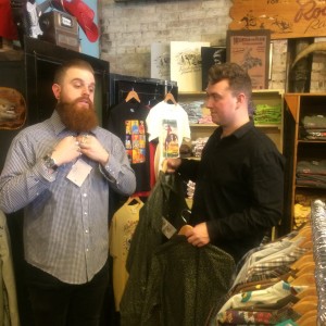Sam Smith, center, and his bandmate Brendan post with Rock mount Ranchwear owner Steven Weil.